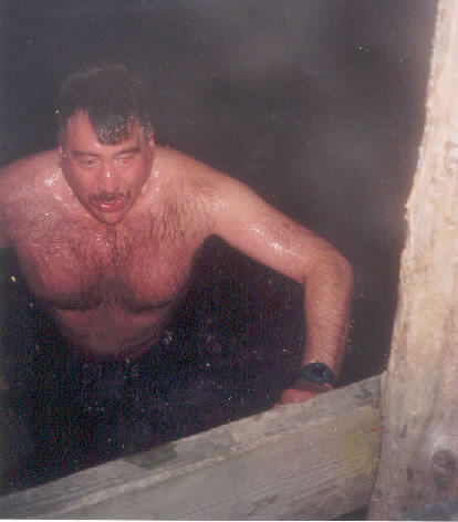 John returning to dock after swim in ice