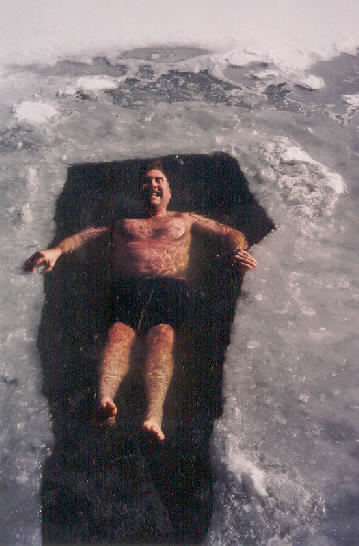 John swimming in hole in ice